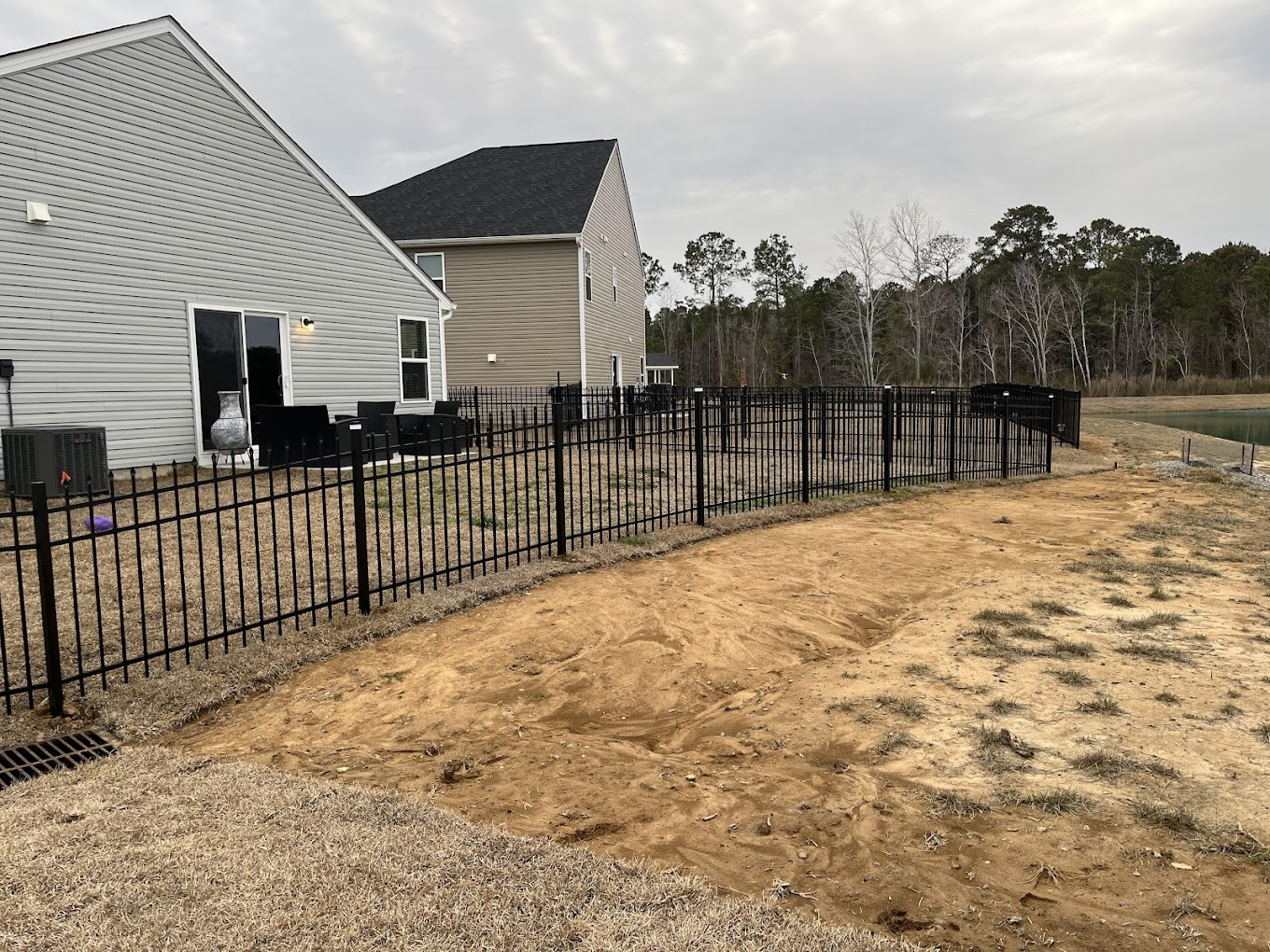 Black metal fence installation project